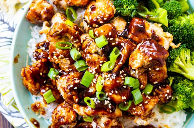 Air Fryer Sesame Chicken over rice with broccoli.