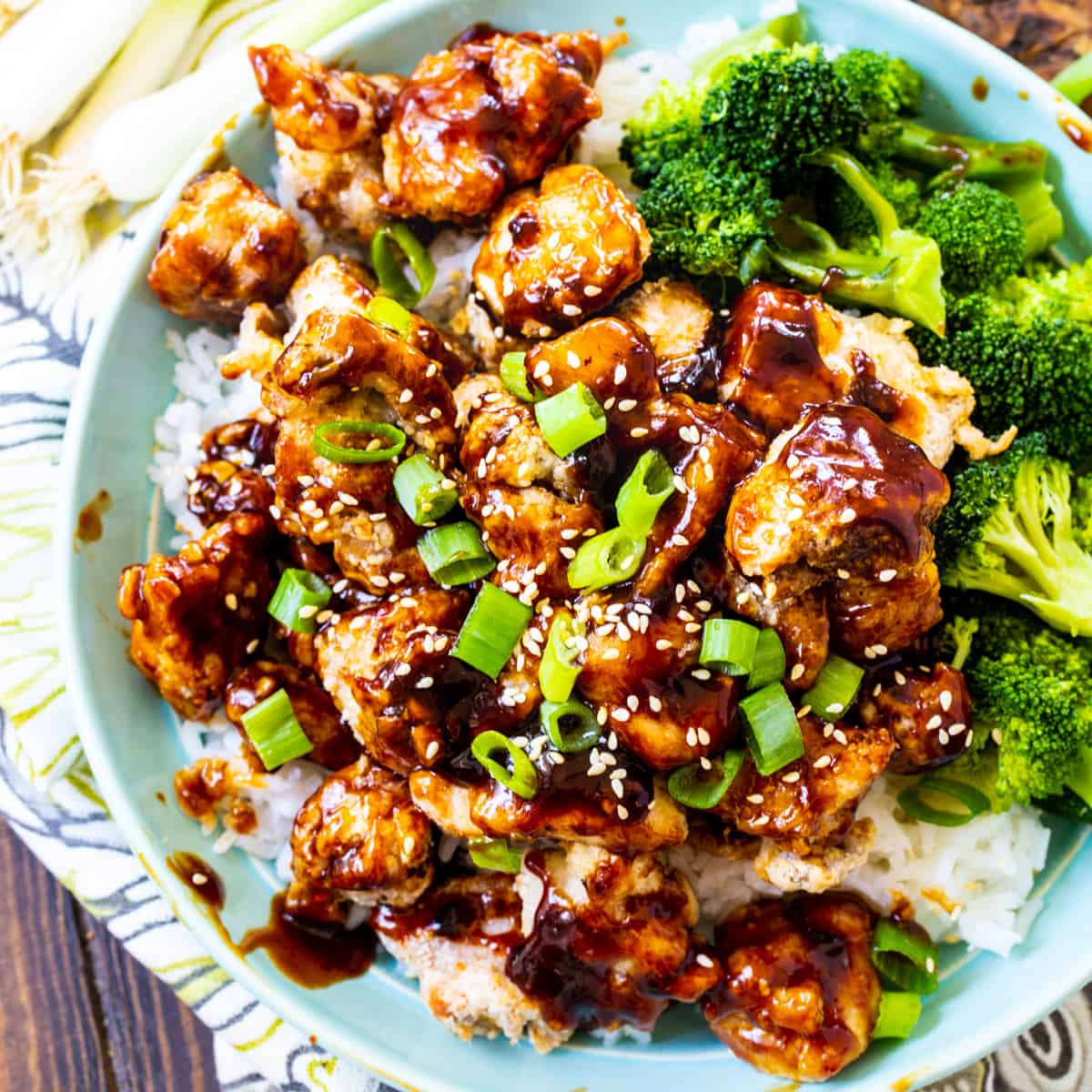 Air Fryer Sesame Chicken over rice with broccoli.
