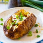Baked Potato topped with sour cream and green onions