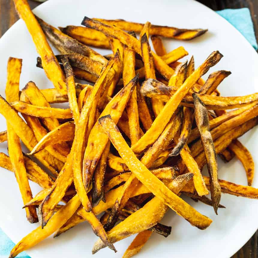 Sweet potato fries on a white plate.
