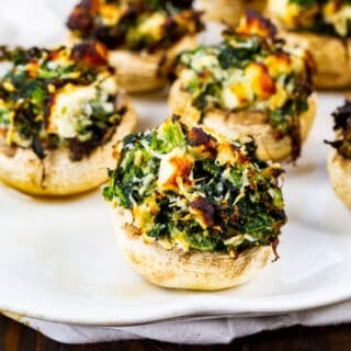 Air Fryer Spinach and Feta Stuffed Mushrooms on a plate.