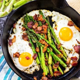 One Pan Bacon, Asparagus, and Egg Breakfast in a cast iron pan.