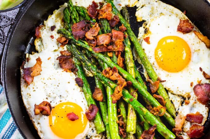 One Pan Bacon, Asparagus, and Egg Breakfast in a cast iron pan.