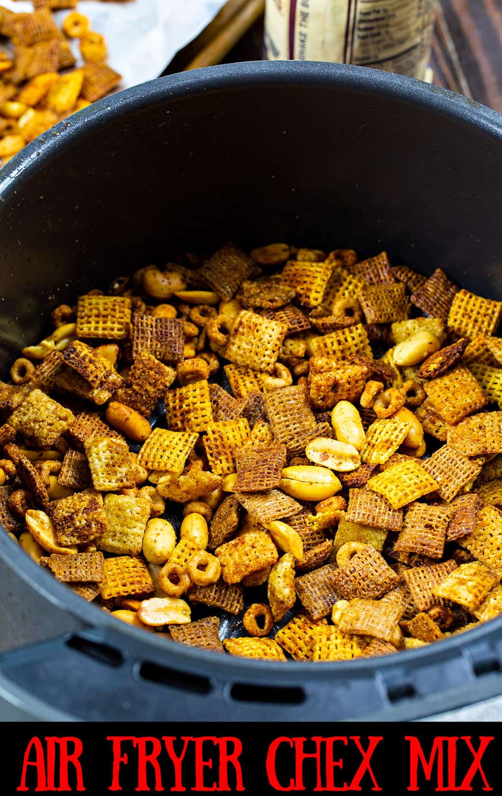 Chex Mix in air fryer basket.