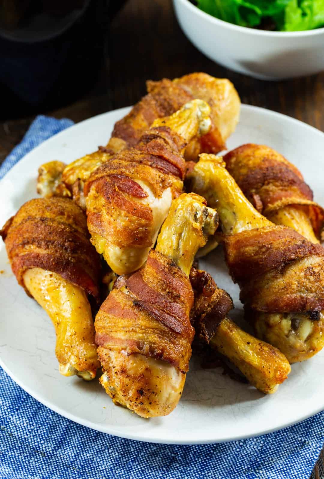 Air Fryer Bacon-Wrapped Chicken Legs on plate.
