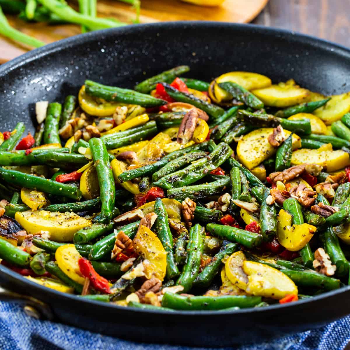 Green Bean and Yellow Squash Saute in a skillet.